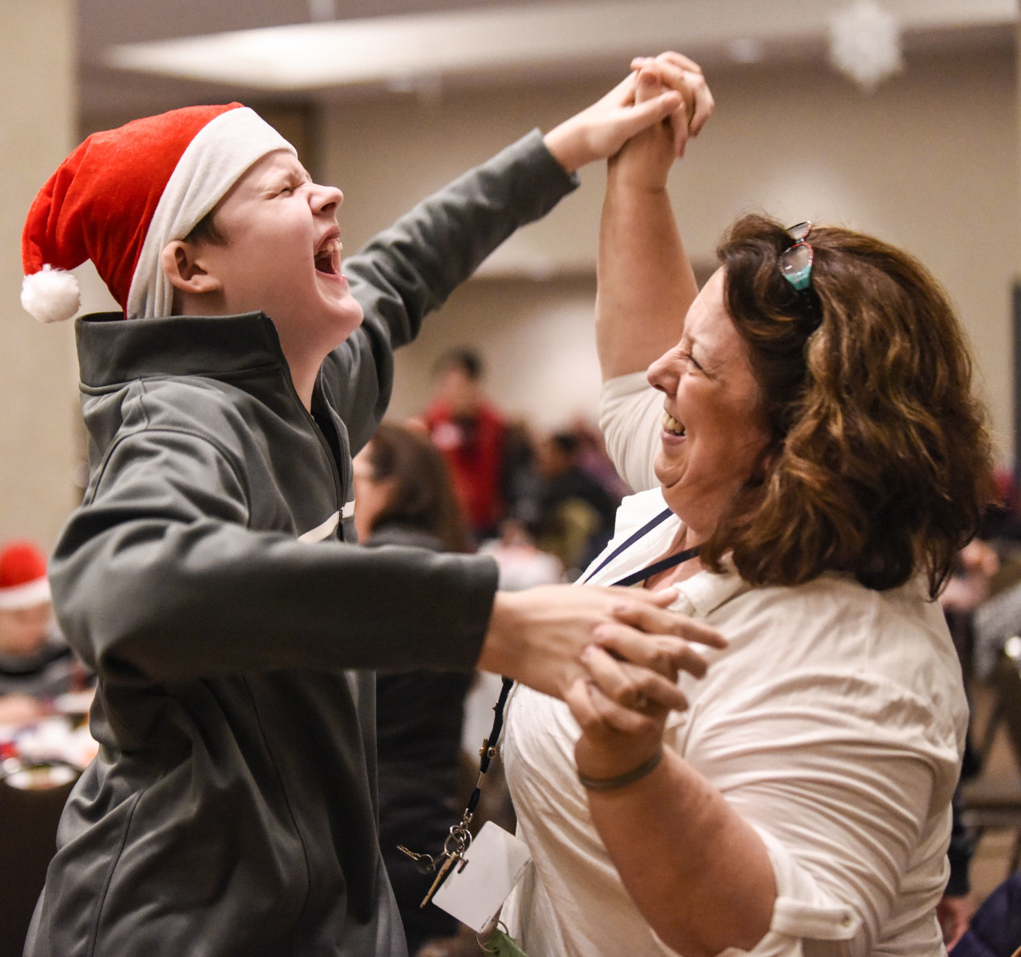 Holiday hugs at annual Happy Joe party